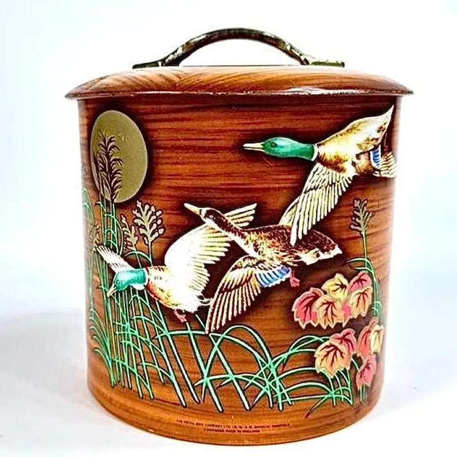 1940s vintage mallard duck cookie tin with faux wood grain finish, barrel-shaped biscuit storage
