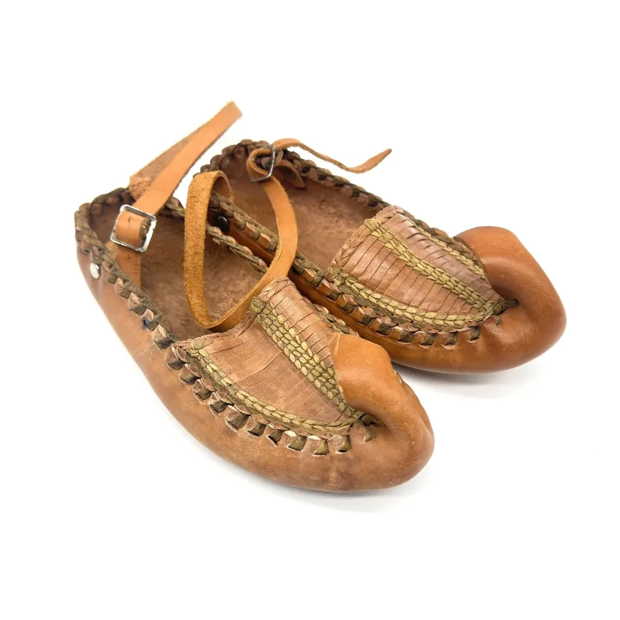 Authentic Serbian opanak shoes size 35 with hand-twisted rustic leather and traditional upturned toe, front view