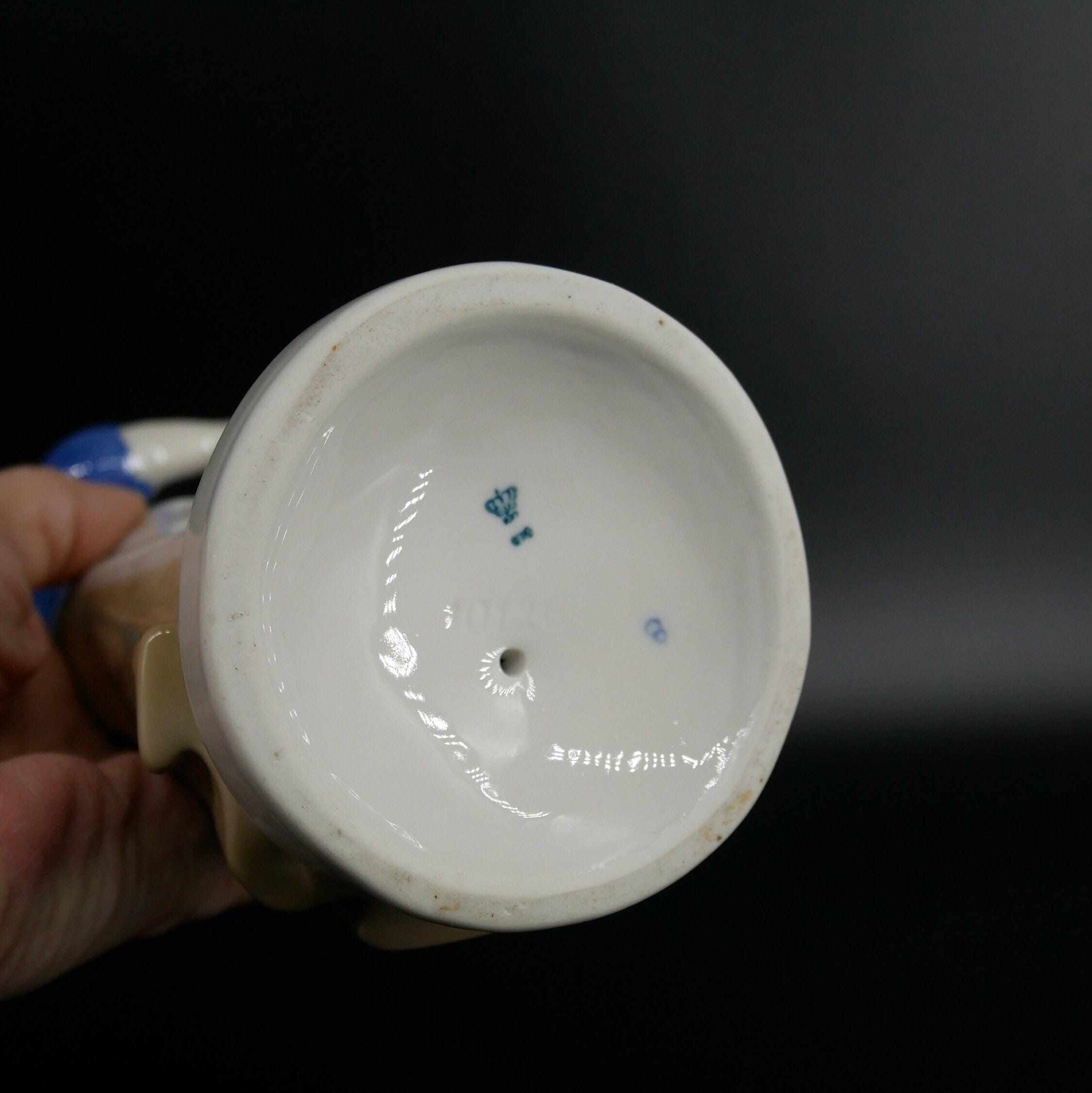 Bottom base detail of porcelain figurine showing Carl Scheidig maker mark and manufacturing information