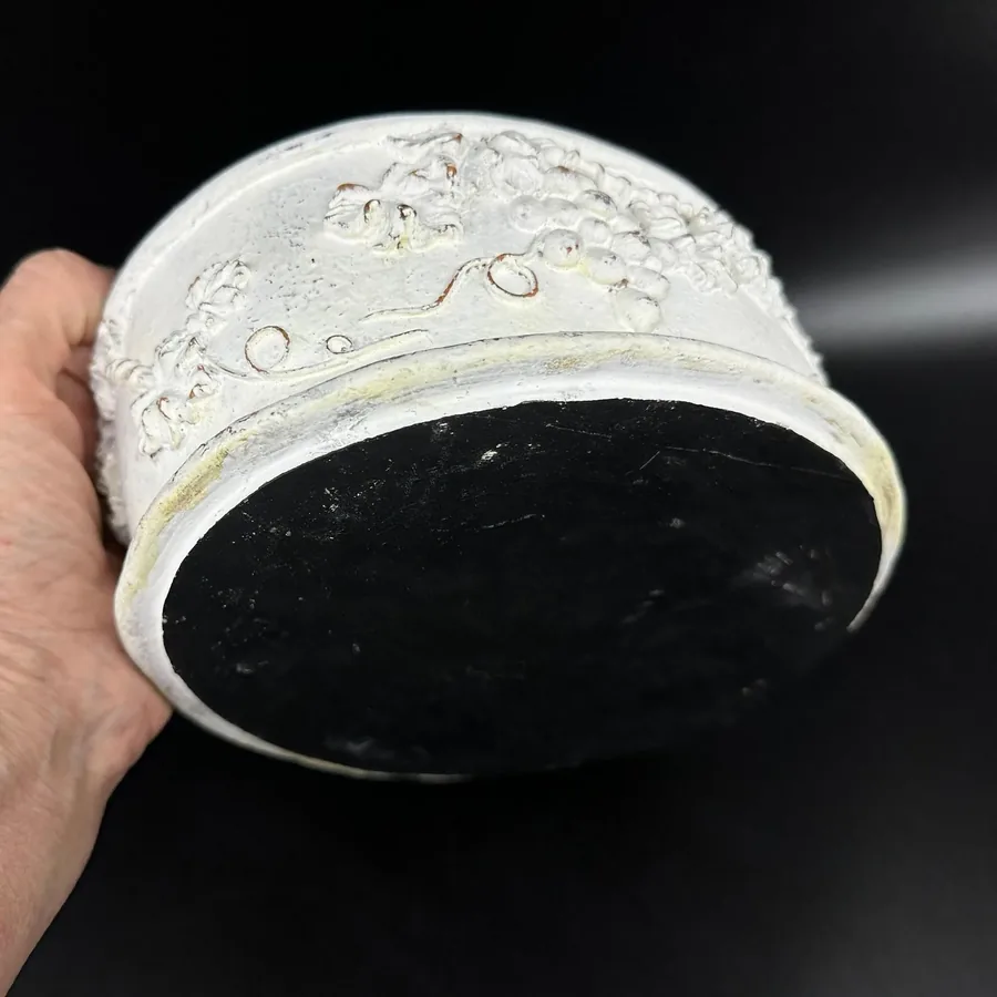 Bottom rim of white Rococo box showing carved edge detail and aged patina finish on hand-painted wood