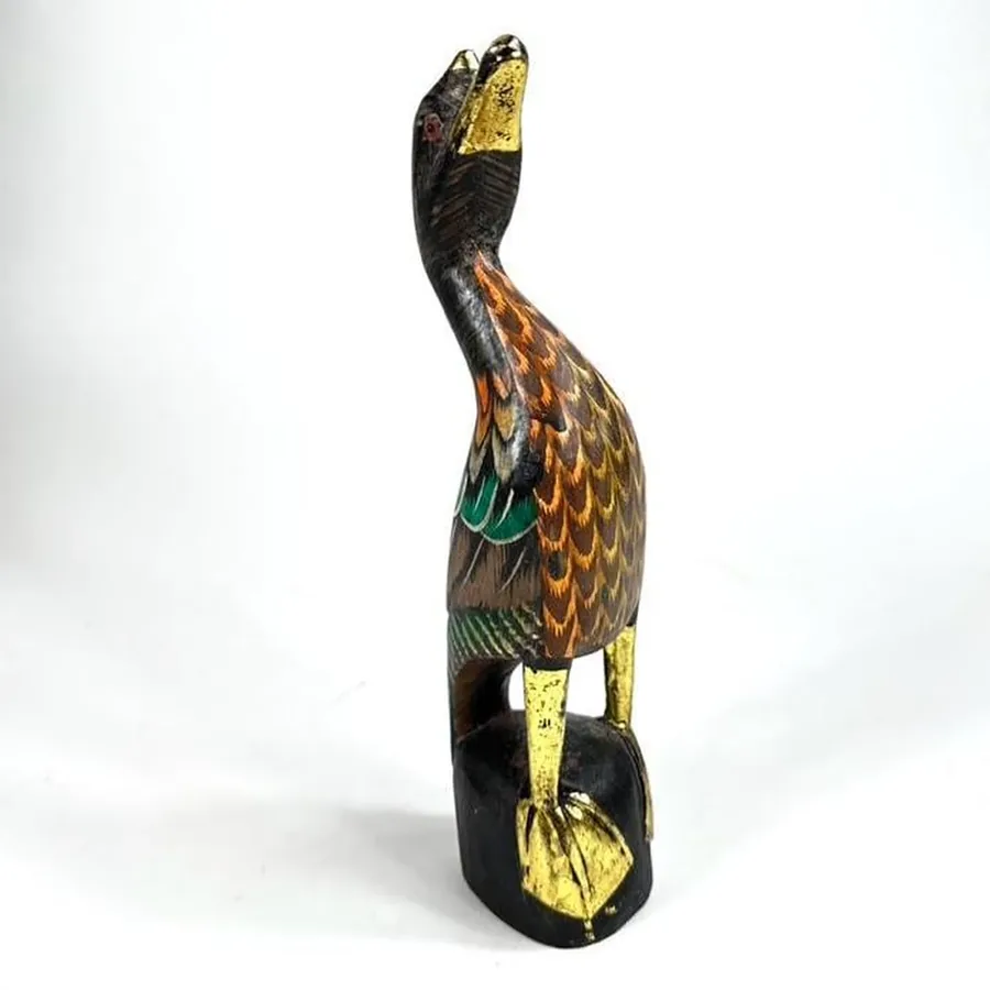 Close-up of duck's tail feathers showing intricate hand-carved detail and hand-painted feather patterns