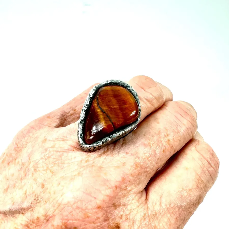 Complete ring presentation showcasing Tiger's Eye and silver setting together, 1970s bohemian statement jewelry