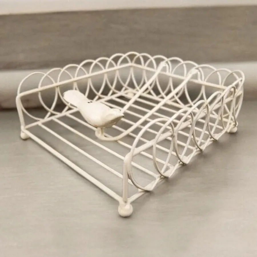 Cream wire napkin holder with geometric diamond lattice sides and ceramic bird perched on top, 1960s mid-century design