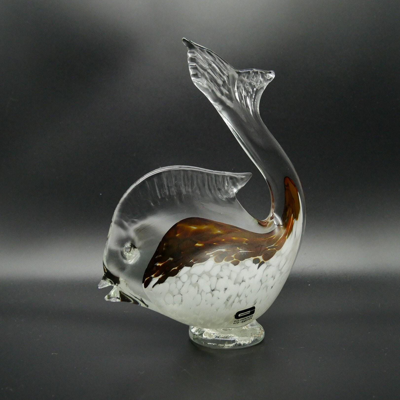 Detailed view of fish head with etched features and clear glass eye, bronze Sommerso layer visible