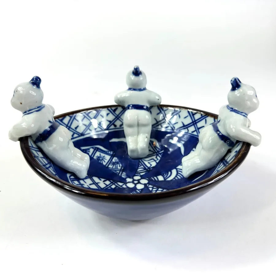Japanese blue white porcelain bowl interior showing central hand-painted design and glaze translucency