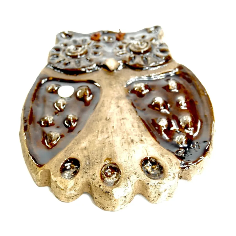 Laholm ceramic owl bottom view showing mounting holes, sculptural foot base, cream body, vintage maker marks