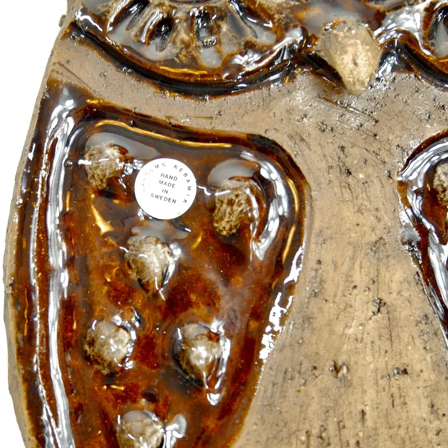 Laholm ceramic owl wing detail showing ornate relief molding, brown glaze texture, vintage patina, dimensioned surface