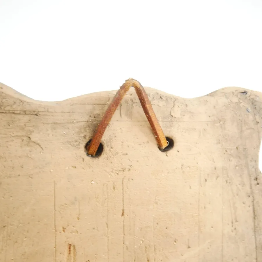 Laholm owl hanging loop detail showing copper wire attachment, mounting preparation, vintage construction method