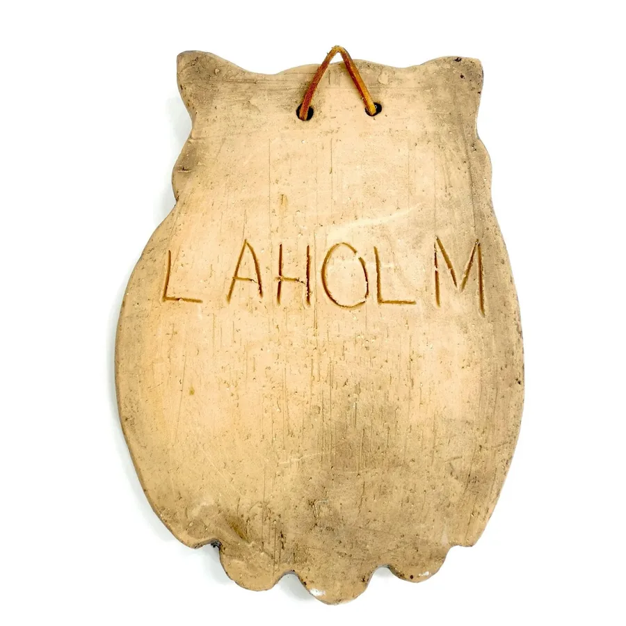 Laholm pottery maker mark engraved in cream ceramic, Swedish pottery signature, vintage studio identifier