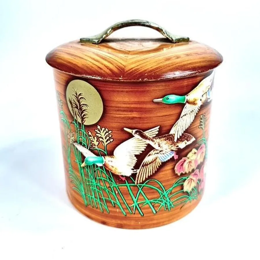 Reverse side view of vintage 1940s mallard duck tin showing alternate artwork composition