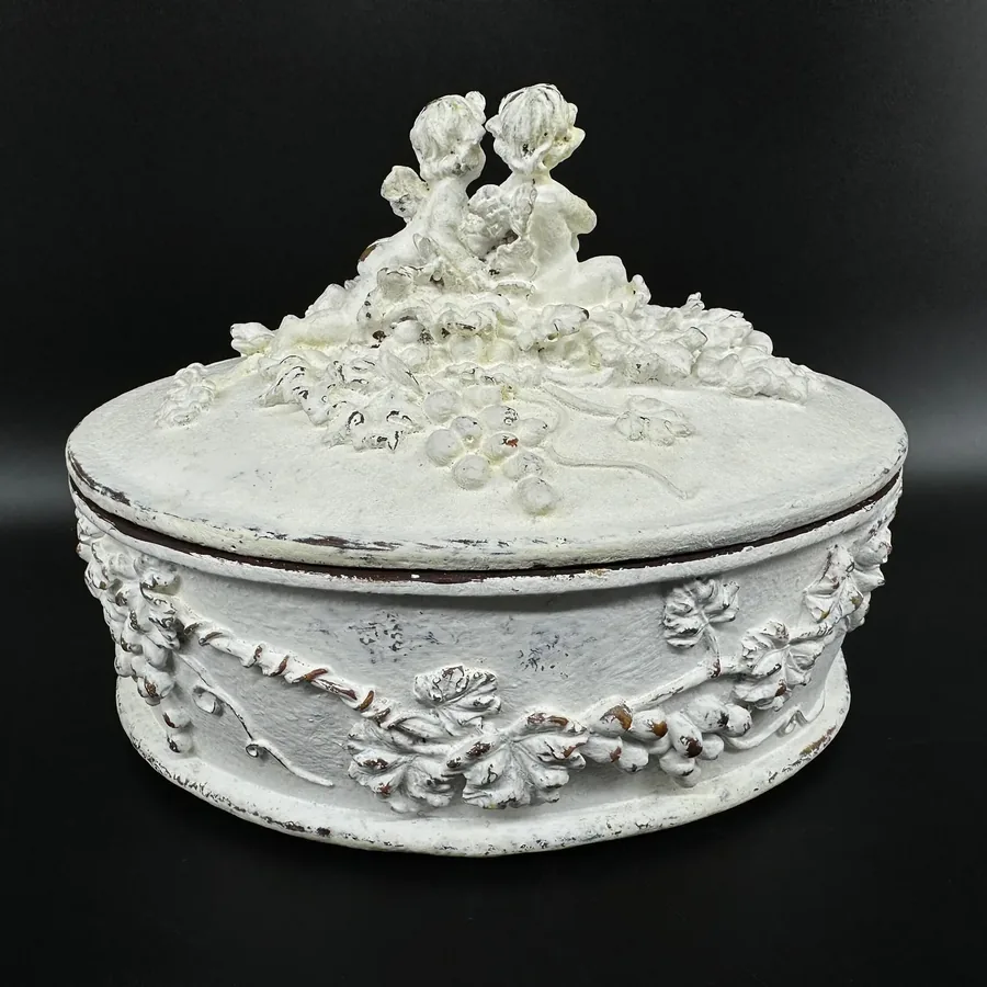Rococo white wood box with carved cherub finial and floral garland band, three-quarter front view
