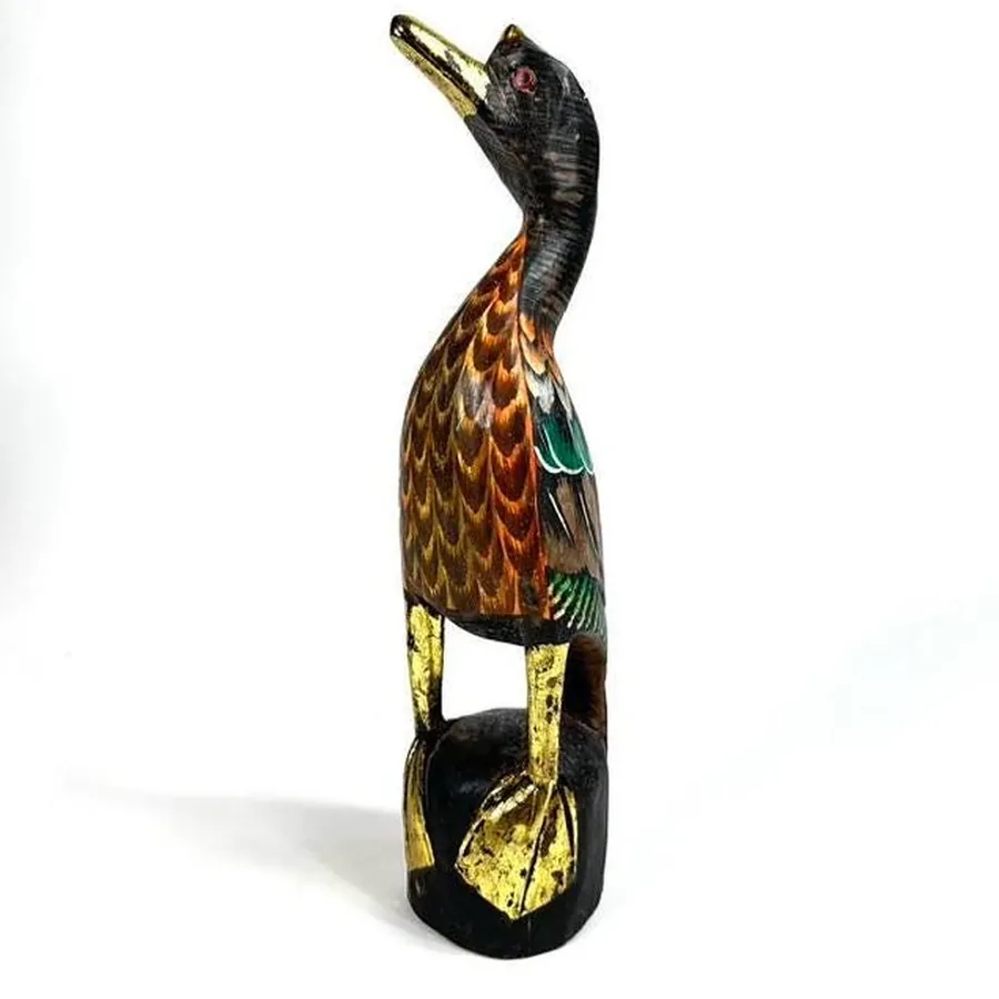 Side view of hand-carved wood duck showing depth, dimensional sculpting, and hand-applied paint finish