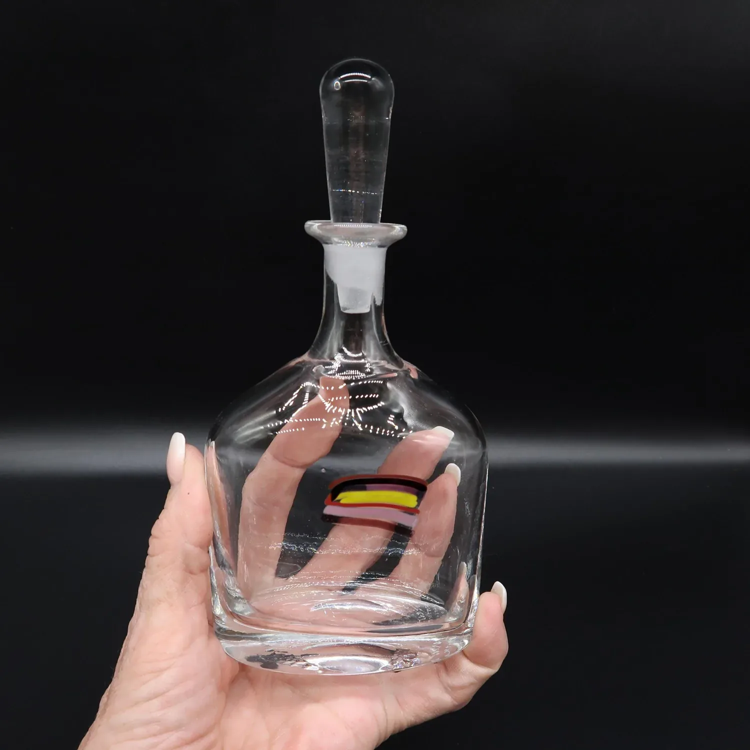 Signed Bertil Vallien Kosta Boda Sweden hand-blown crystal perfume bottle with rainbow stripe detail, front view