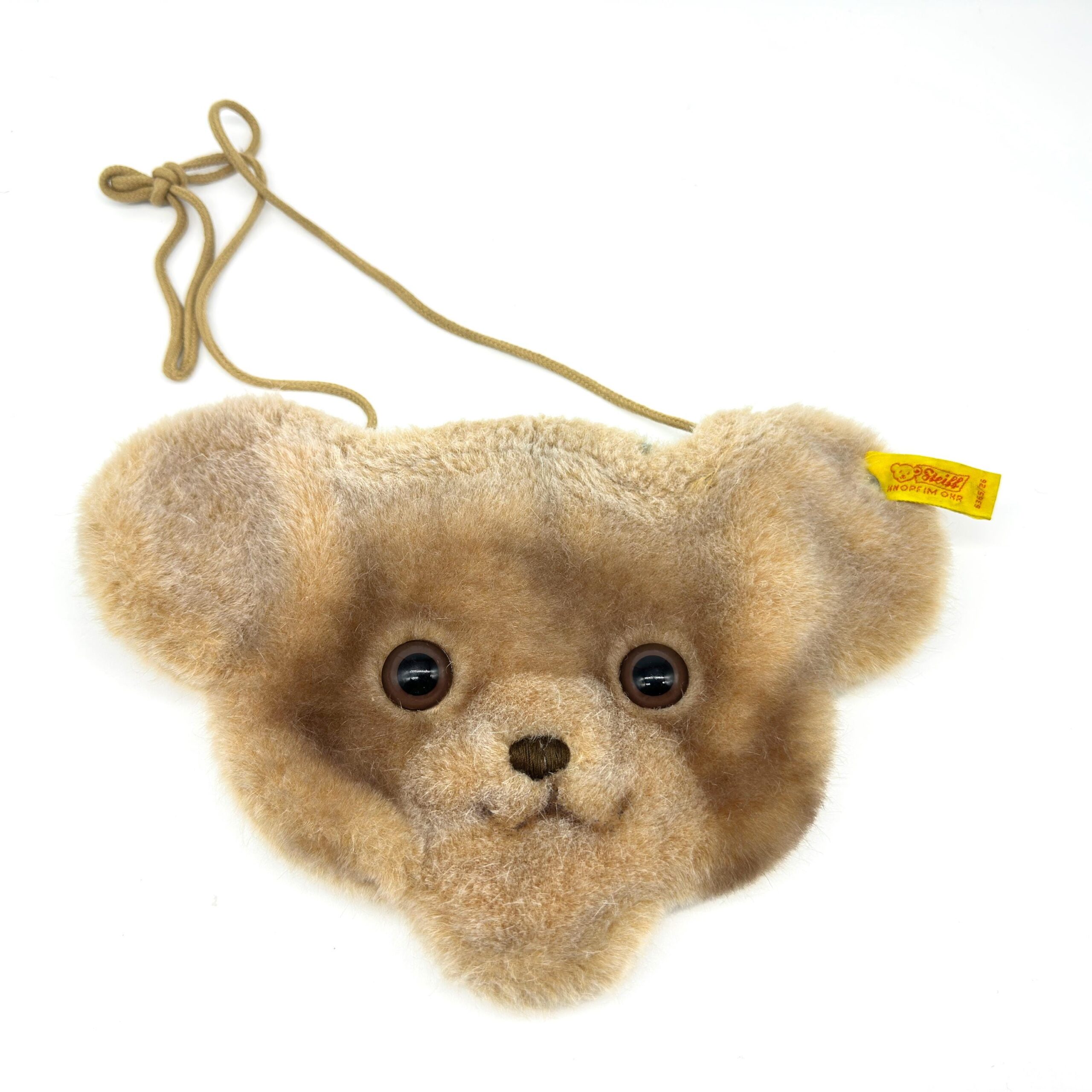 Vintage 1980s Steiff bear purse with soft beige plush, authentic button in ear, and braided cord strap