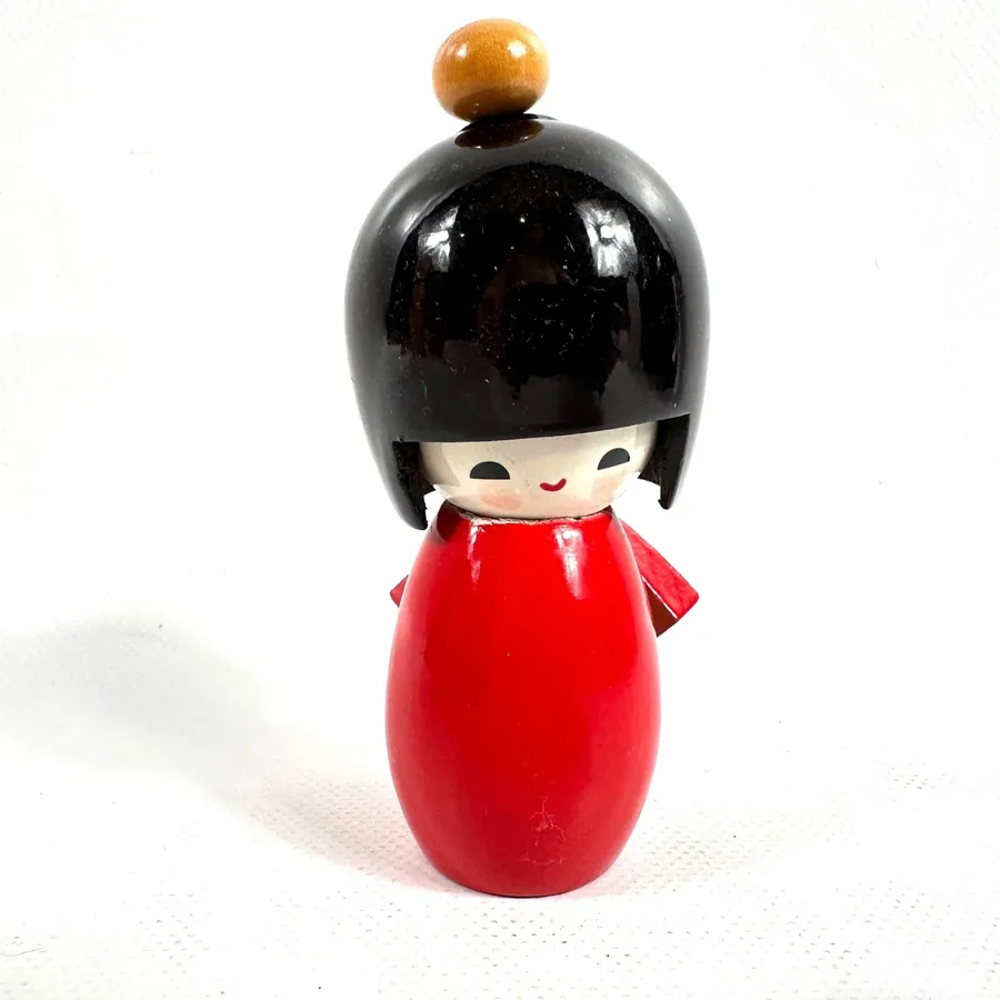 Vintage Japanese kokeshi doll with hand-painted red kimono, black lacquered hair, 13cm wooden figurine