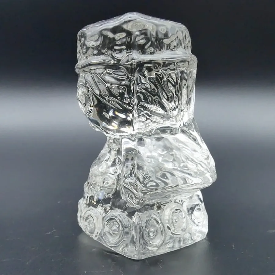 Vintage Reijmyre Swedish angel with traditional costume base, captured in soft studio lighting