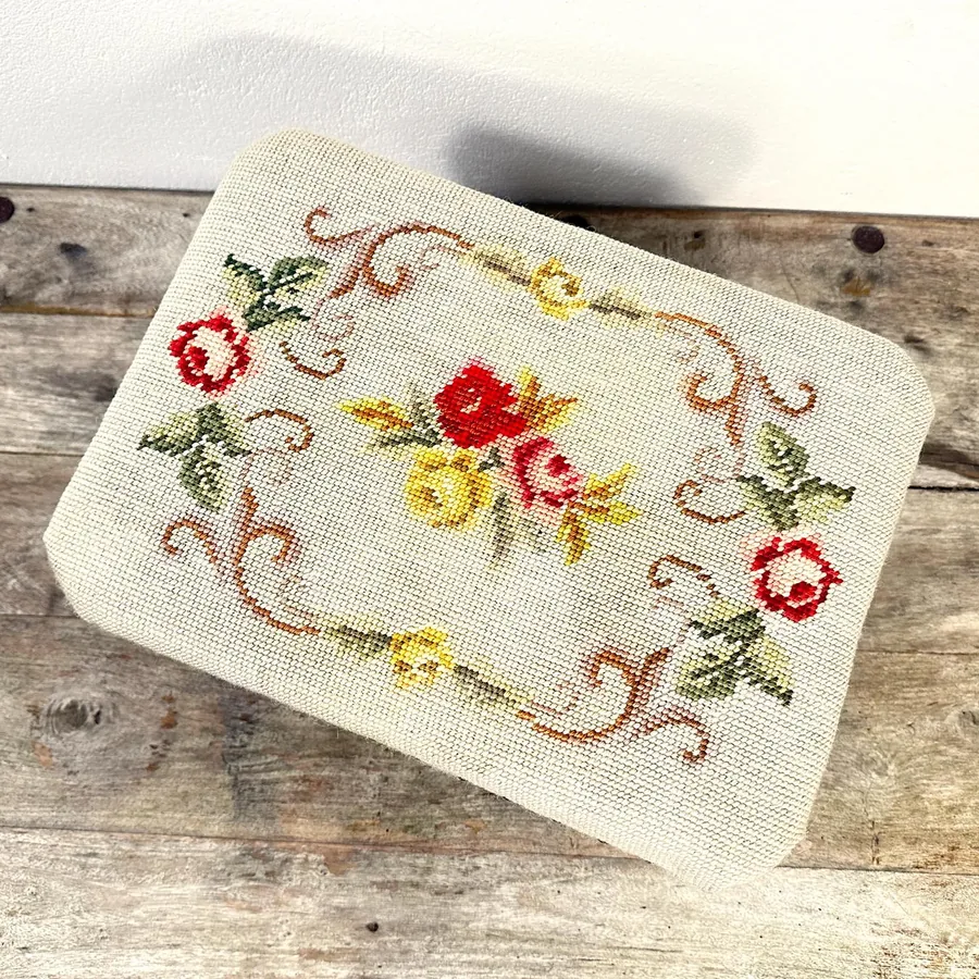 Wooden footstool legs and base structure showing Swedish joinery construction and weight-bearing frame design