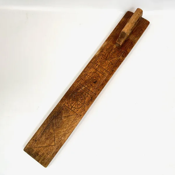 1862 Swedish hand-carved wooden mangling board with incised geometric folk patterns, full length view showing natural honey-b