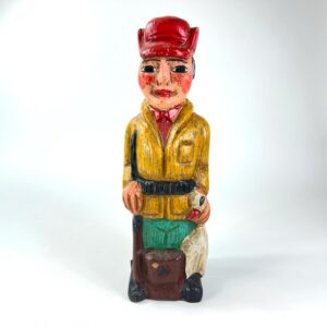 Hand-carved wooden wine bottle box featuring red-capped huntsman in yellow jacket with green trousers, folk art design from 1