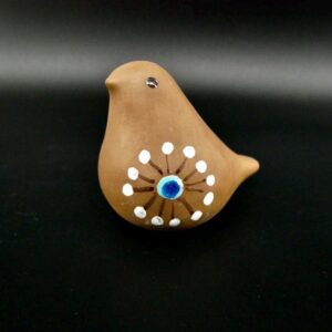 Swedish DECO pottery bird, 1950s terracotta ceramic with hand-painted white dot pattern, cobalt blue glass eye, front-facing