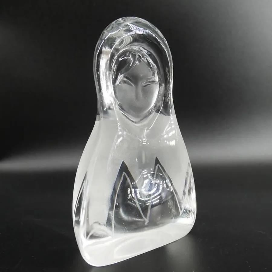 Angled three-quarter view of crystal glass showing frosted base geometric patterns and clear upper portion