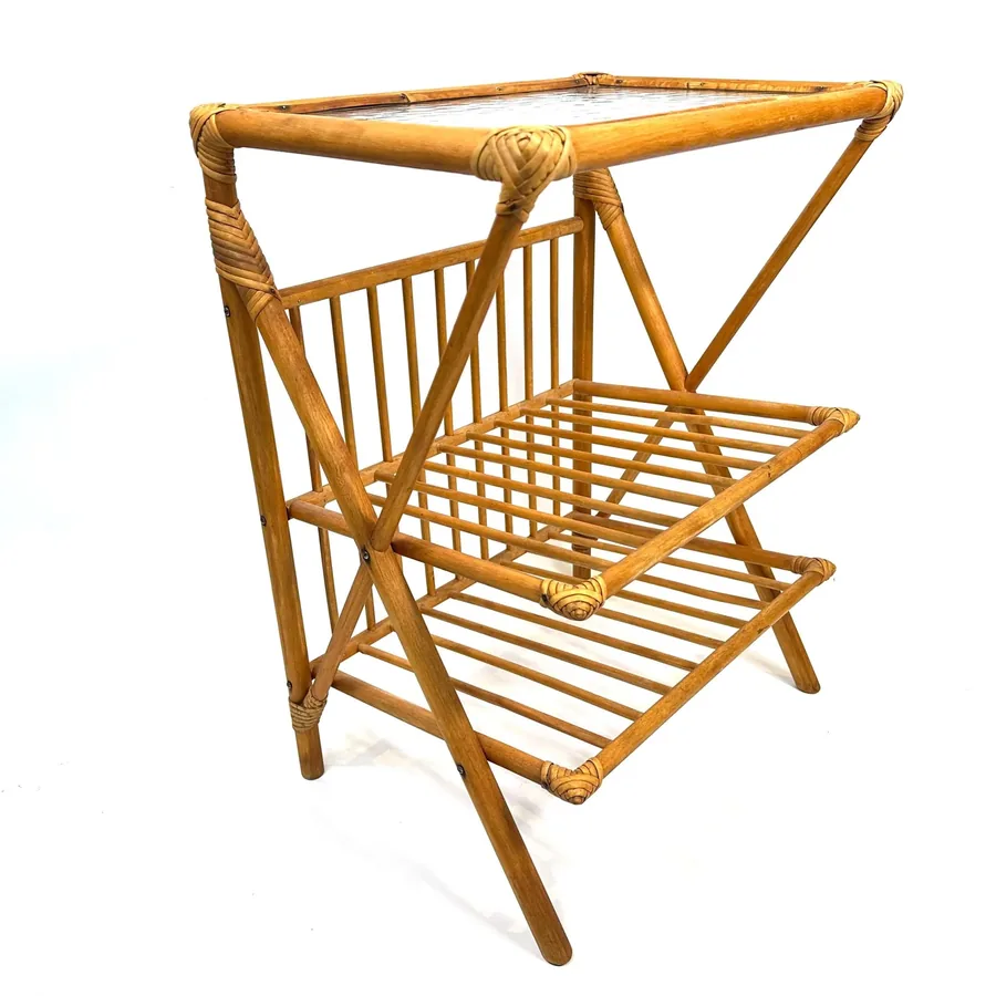 Bamboo side table with glass top and two lower shelves, three-quarter view showing geometric frame structure and natural wood