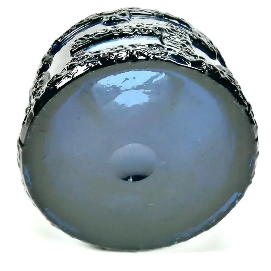 Bottom base view of Brutalist blue vase showing glass pontil mark, base construction, and structural foundation