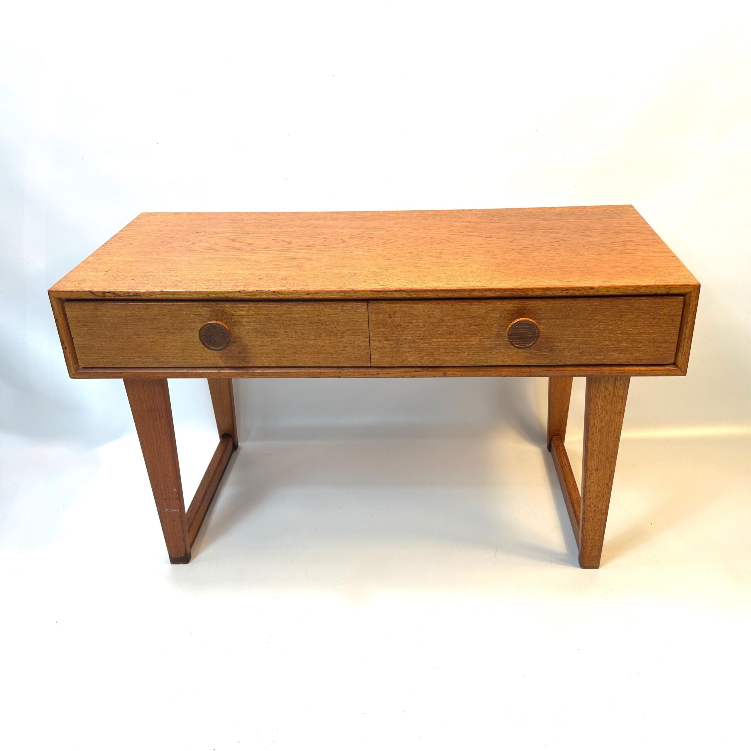 Danish modern teak hall table with two drawers, circular pulls, splayed legs, 1970s Scandinavian design