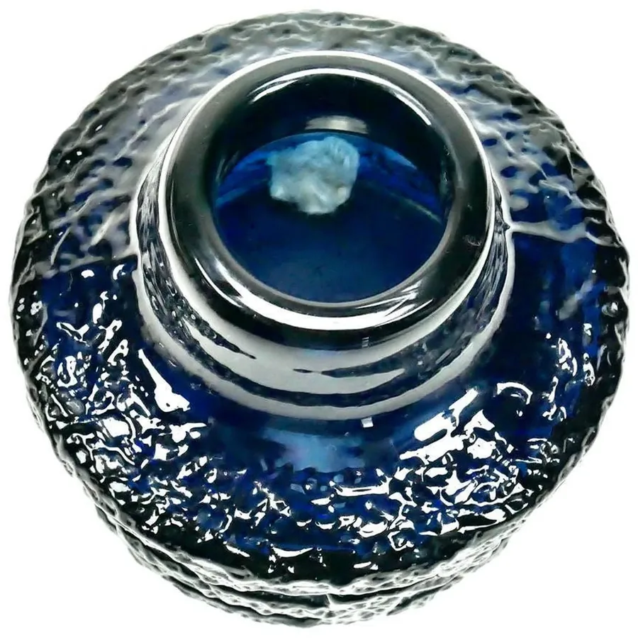 Direct top-down view of cobalt blue vase crown opening, showing glossy rim and interior transparency with light reflection