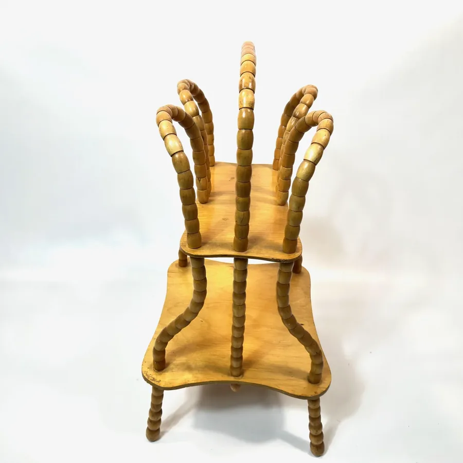 Rear view of vintage wooden rack showing back support structure and rotating spindle mechanism clearly visible