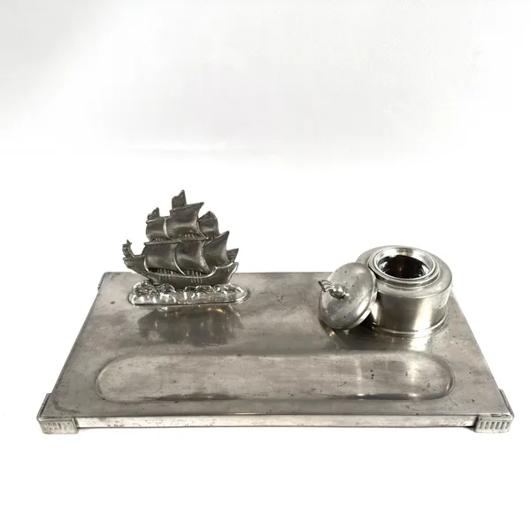 Sailing ship figurine with ink vessel and open lid on pewter base, showing inkwell detail and ship rigging