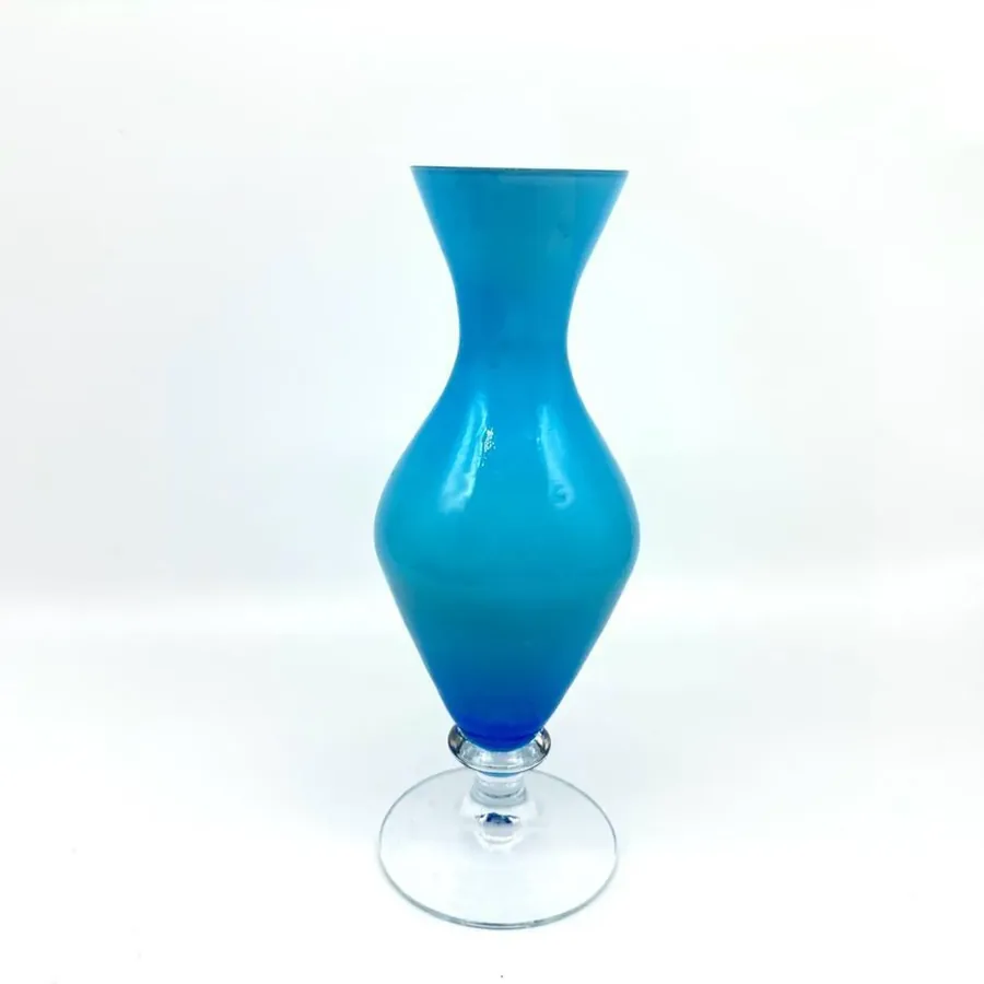 Scandinavian blue opaline glass vase from 1960s with distinctive bulbous shape, vibrant turquoise casing, and clear pedestal