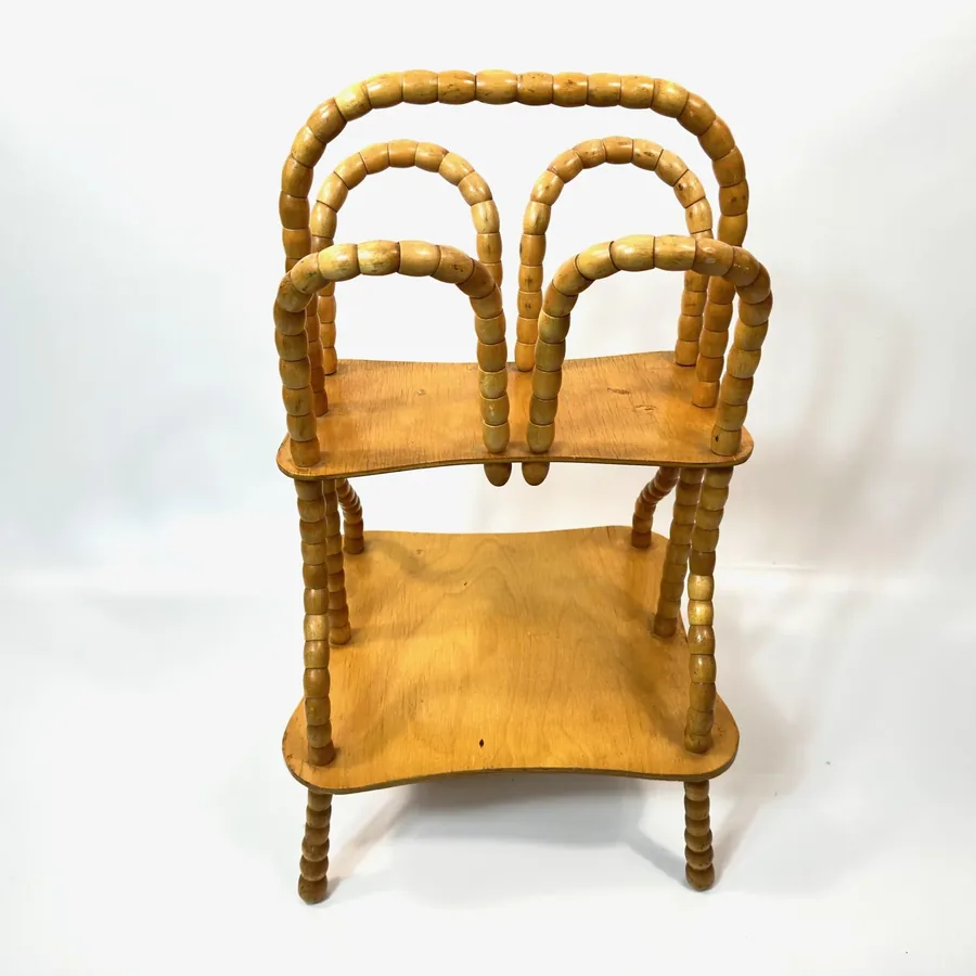 Straight-ahead view of honey wood shelving with rotating bead frame and visible wood grain texture throughout