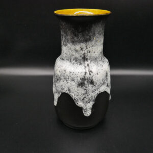 Vintage West Germany fat lava ceramic vase with textured white glaze, black base, and golden rim, front view