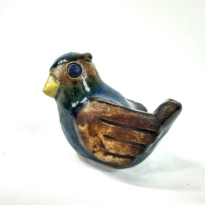 Willy Fischer ceramic bird figurine, 1960s Swedish pottery with cobalt glaze and golden-brown wings, left profile view