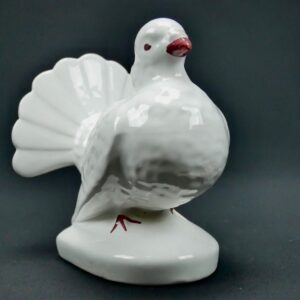 White porcelain dove planter by Pereiras, Portugal. Glazed bird figurine with detailed feather texture, pink beak, and pedest