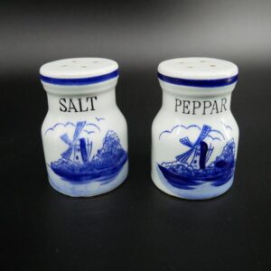 Pair of vintage Delft Blue salt and pepper shakers with hand-painted Dutch windmill scenes and cobalt blue rim trim
