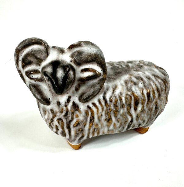 Front-angled view of handmade sheep with detailed ears and wool texture across the complete body