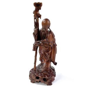 Hand-carved wooden scholar figure with staff, flowing robes, serene expression, rich brown patina, mid-20th century Asian imm