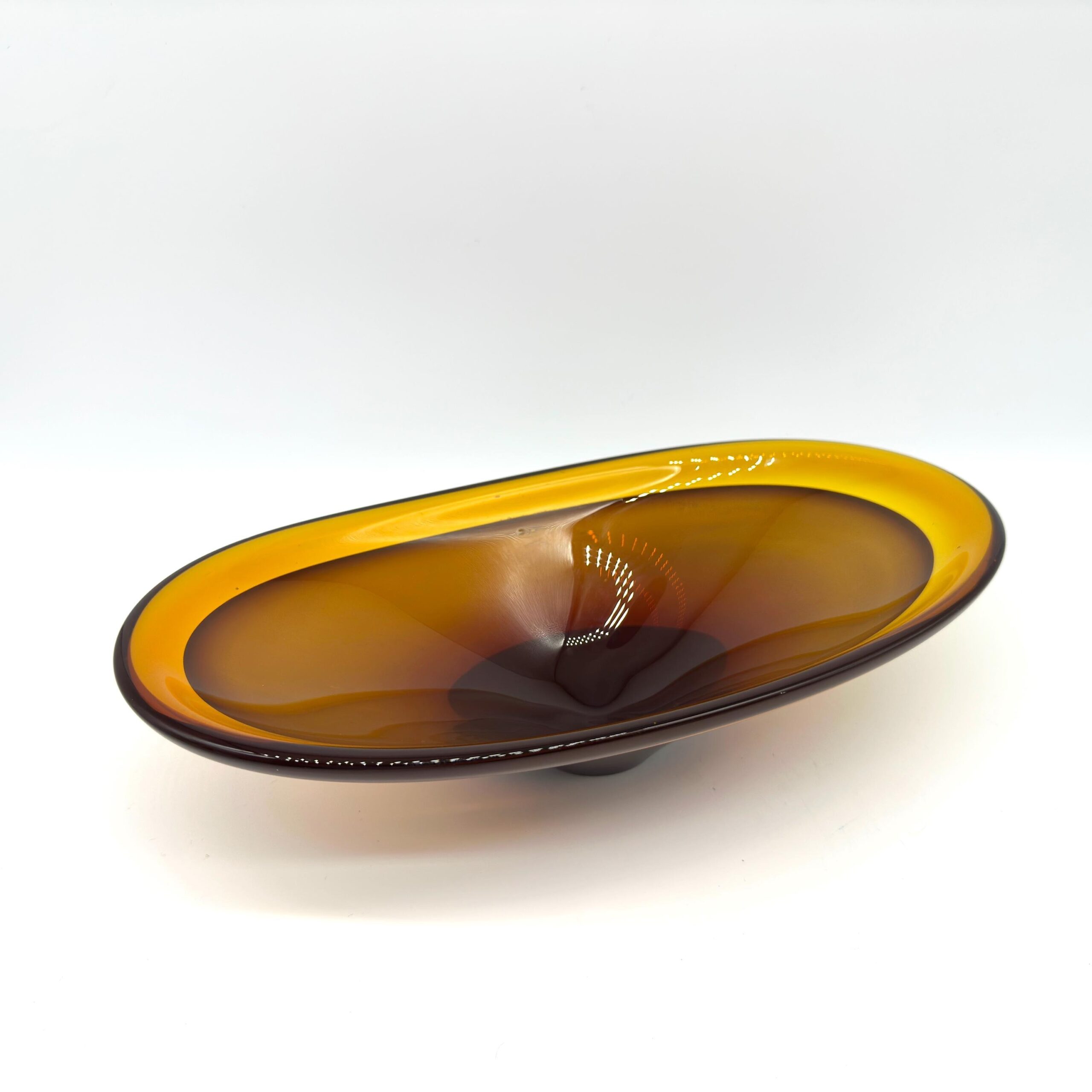 Murano-style amber art glass bowl with hand-blown radiant cognac gradient, conical base, overhead view