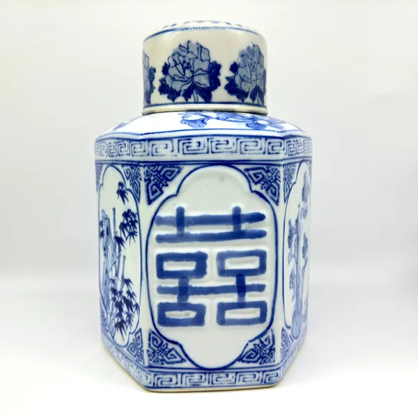 Blue and white porcelain hexagonal jar with Double Happiness, domed lid, clean neutral background