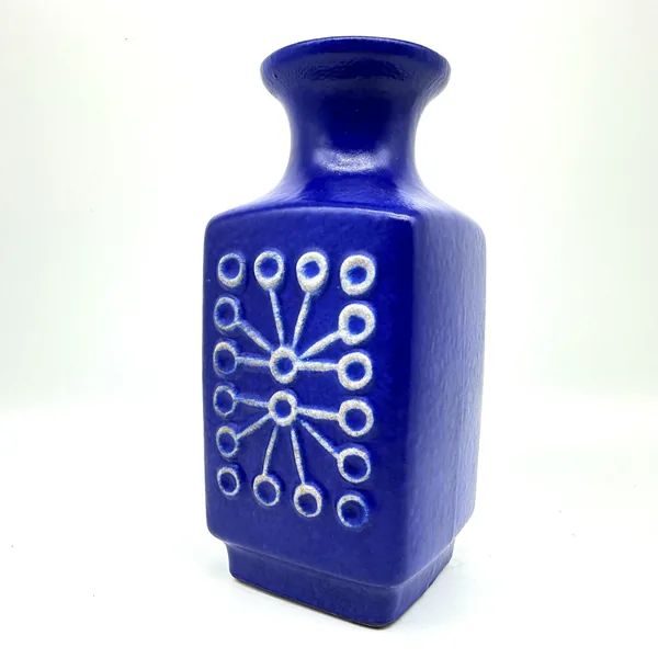 Blue ceramic Sputnik vase front-facing position displaying geometric dot-and-line pattern symmetry