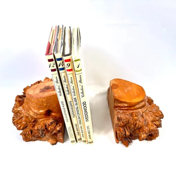 Burl wood bookends pair photographed front-facing with classic vintage books positioned between them, highlighting natural wo