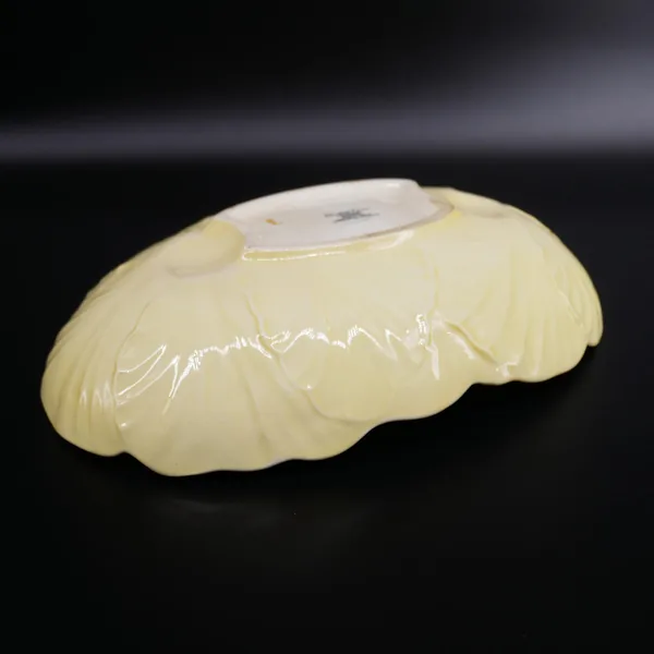 Carlton Ware Buttercup bowl underside, pale cream glaze showing maker's mark and Australian Design backstamp, no visible crac