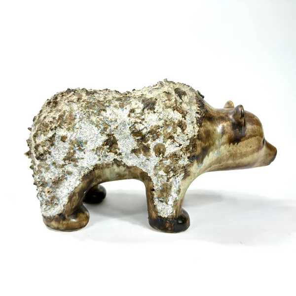 Ceramic bear positioned at angle showing entire silhouette, textured stoneware surface, and dimensional sculptural depth