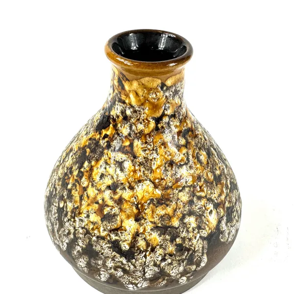 Close overhead view of lava vase rim and crater pattern detail showing glaze thickness