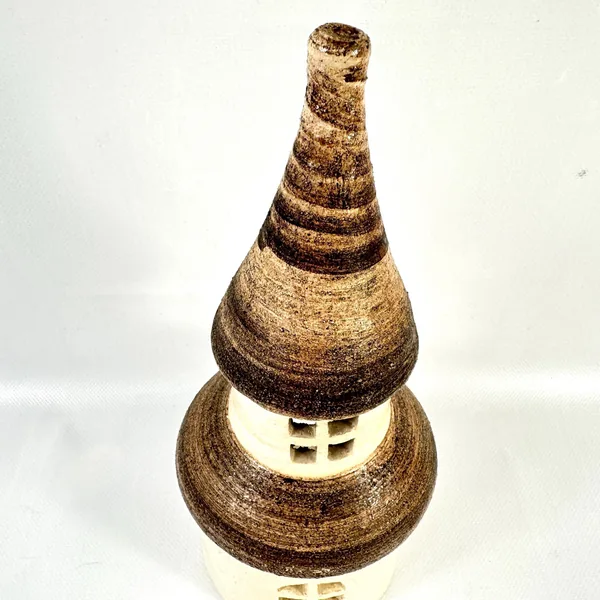 Close-up of hand-painted striped conical roof with aged brown and tan glazing, geometric banding pattern, textured pottery su