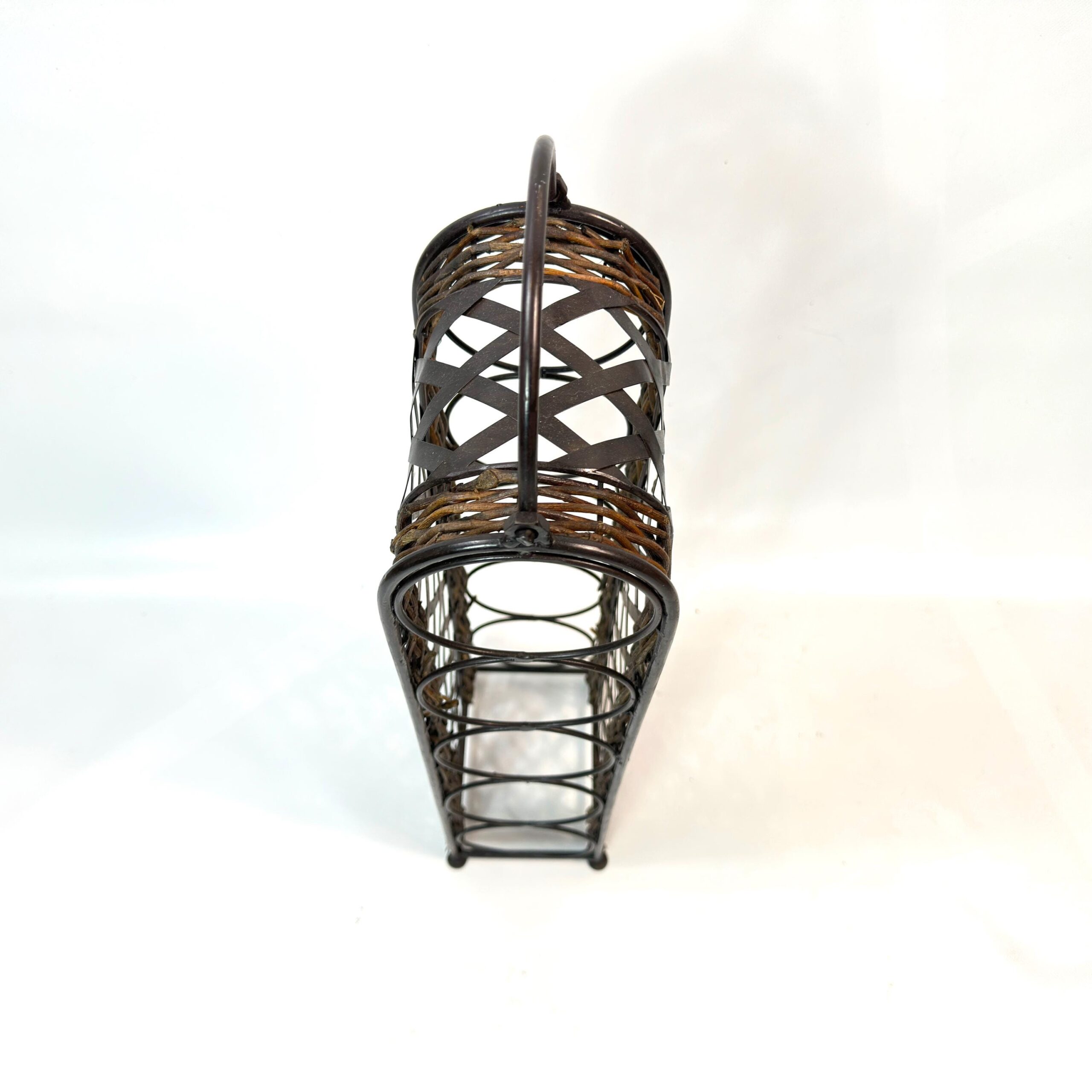 Close-up of wine rack top showing curved metal handle and wicker band detail across the upper section
