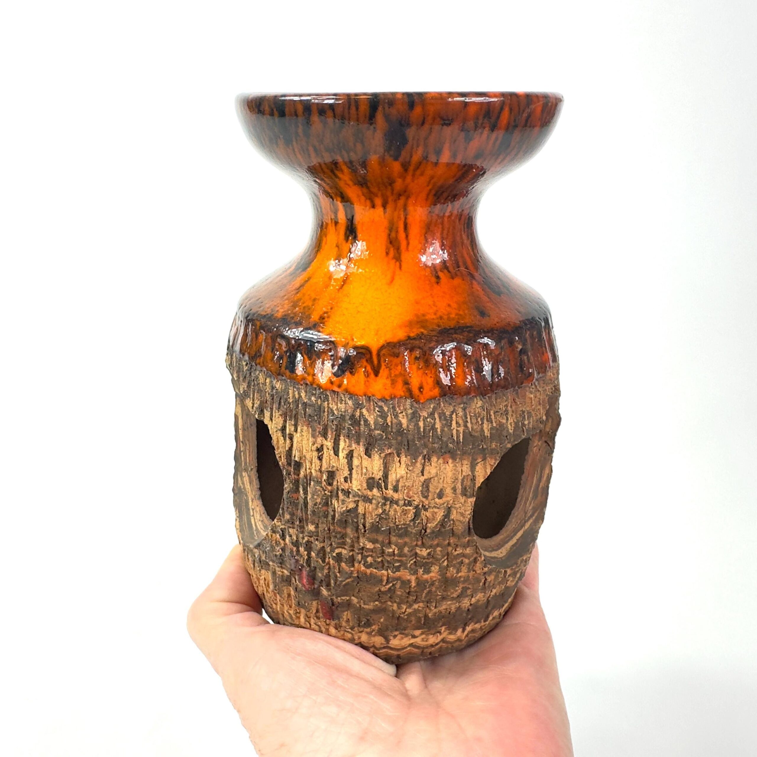 Danish studio pottery candleholder in hand, 1970s glazed stoneware with brown drip glaze and ochre interior, signed base visi