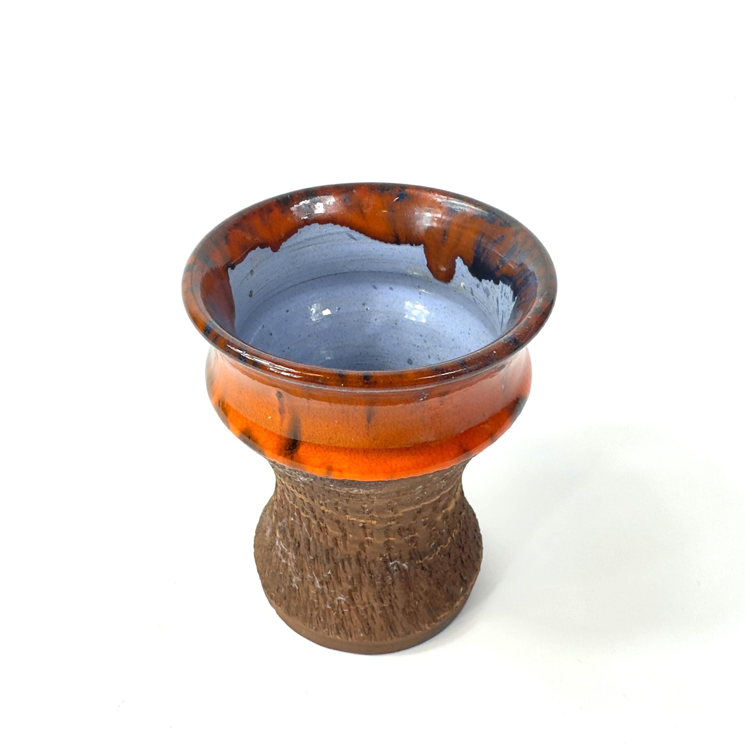 Danish vase side view displaying blue interior glaze against orange and brown exterior ceramic layers